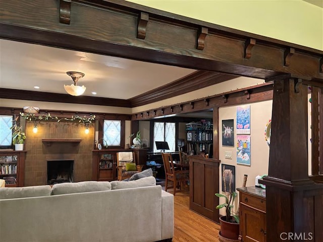 163 S Kingsley, Los Angeles, CA 90004 - living room featuring ornamental molding, light wood finished floors, and a fireplace