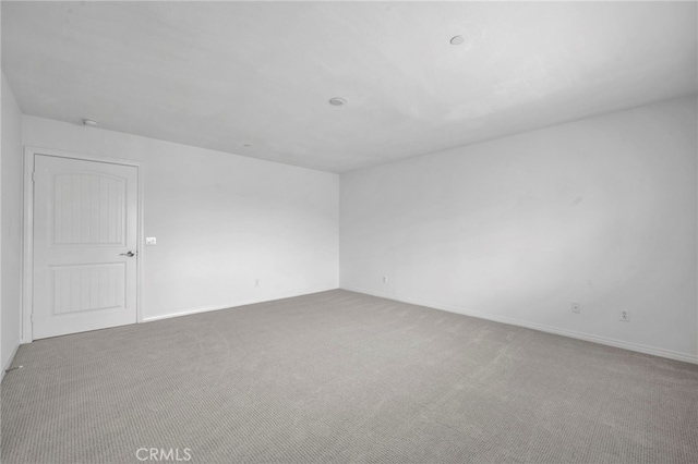 6864 Ripple Ct, Jurupa Valley, CA 91752 - empty room with carpet floors and baseboards