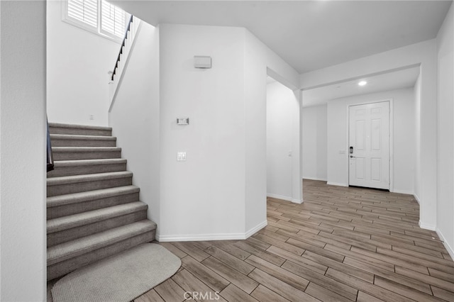 6864 Ripple Ct, Jurupa Valley, CA 91752 - foyer entrance featuring stairs, wood finished floors, baseboards, and recessed lighting