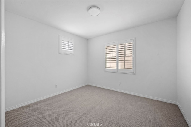 6864 Ripple Ct, Jurupa Valley, CA 91752 - carpeted spare room featuring baseboards