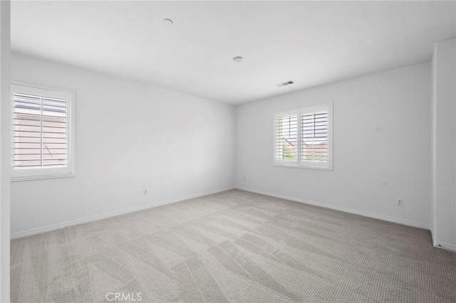 6864 Ripple Ct, Jurupa Valley, CA 91752 - spare room featuring light carpet and baseboards