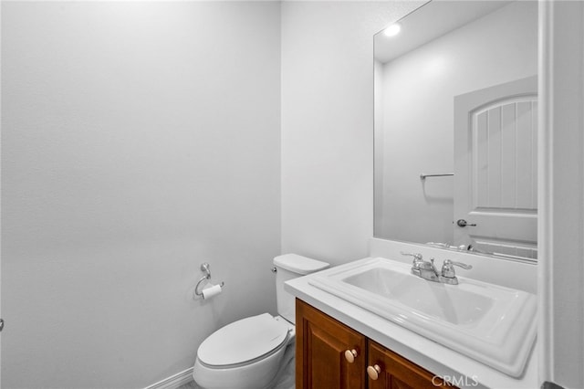 6864 Ripple Ct, Jurupa Valley, CA 91752 - bathroom featuring vanity, toilet, and baseboards