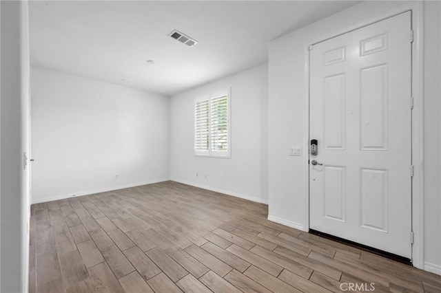 6864 Ripple Ct, Jurupa Valley, CA 91752 - entryway featuring wood finished floors and baseboards