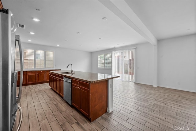 6864 Ripple Ct, Jurupa Valley, CA 91752 - kitchen with appliances with stainless steel finishes, open floor plan, light wood finished floors, and recessed lighting