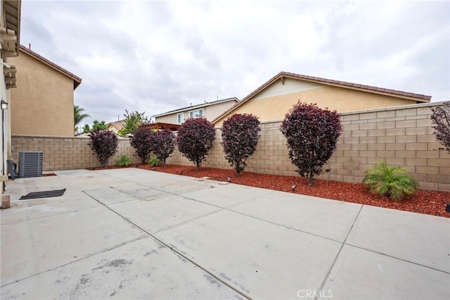6864 Ripple Ct, Jurupa Valley, CA 91752 - fenced backyard with a patio and central air condition unit