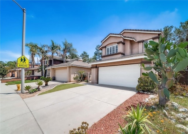 11015 Charleston St, Rancho Cucamonga, CA 91701 - view of front of home with a garage, stucco siding, and concrete driveway