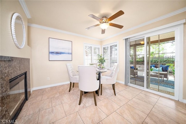 11015 Charleston St, Rancho Cucamonga, CA 91701 - dining room with ornamental molding, a ceiling fan, a fireplace, tile patterned flooring, and baseboards