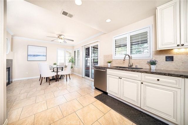 11015 Charleston St, Rancho Cucamonga, CA 91701 - kitchen with a sink, stainless steel dishwasher, baseboards, decorative backsplash, and ornamental molding