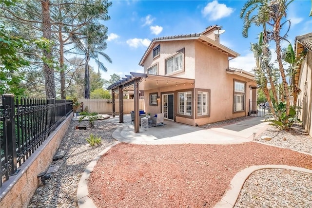 11015 Charleston St, Rancho Cucamonga, CA 91701 - rear view of house featuring stucco siding, a chimney, a fenced backyard, and a patio area