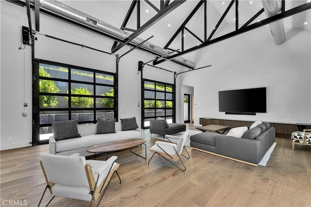 25057 Lewis And Clark Rd, Hidden Hills, CA 91302 - living area with a high ceiling, wood finished floors, recessed lighting, and baseboards