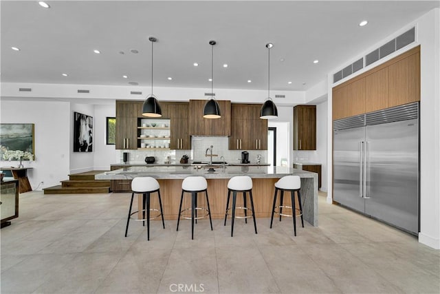 25057 Lewis And Clark Rd, Hidden Hills, CA 91302 - kitchen featuring stainless steel built in fridge, modern cabinets, open shelves, decorative backsplash, and recessed lighting