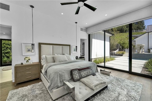 25057 Lewis And Clark Rd, Hidden Hills, CA 91302 - bedroom with access to exterior, wood finished floors, recessed lighting, a towering ceiling, and ceiling fan