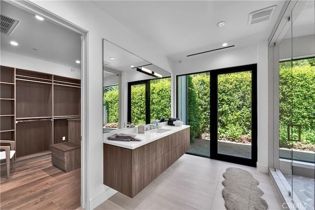 25057 Lewis And Clark Rd, Hidden Hills, CA 91302 - bathroom with healthy amount of natural light, double vanity, and recessed lighting