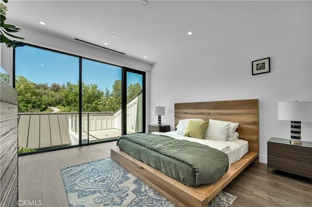 25057 Lewis And Clark Rd, Hidden Hills, CA 91302 - bedroom featuring access to exterior, wood finished floors, and recessed lighting