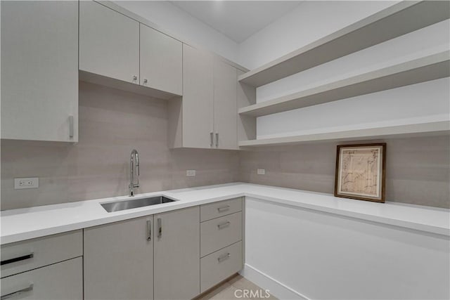 25057 Lewis And Clark Rd, Hidden Hills, CA 91302 - kitchen featuring a sink, open shelves, backsplash, and light countertops