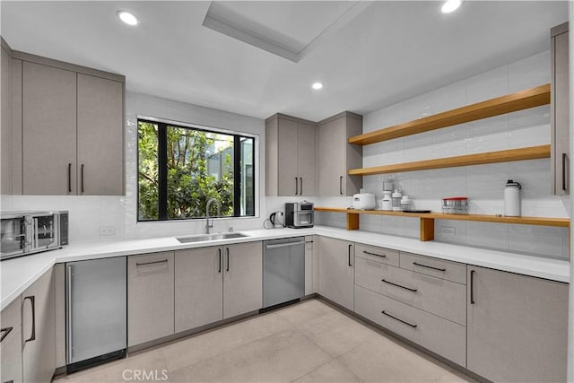 25057 Lewis And Clark Rd, Hidden Hills, CA 91302 - kitchen featuring stainless steel appliances, gray cabinetry, tasteful backsplash, a sink, and recessed lighting