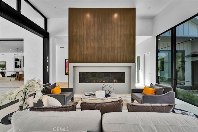 25057 Lewis And Clark Rd, Hidden Hills, CA 91302 - living room featuring a glass covered fireplace and a towering ceiling