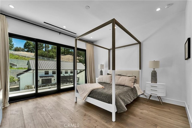 25057 Lewis And Clark Rd, Hidden Hills, CA 91302 - bedroom with access to outside, wood finished floors, recessed lighting, and baseboards