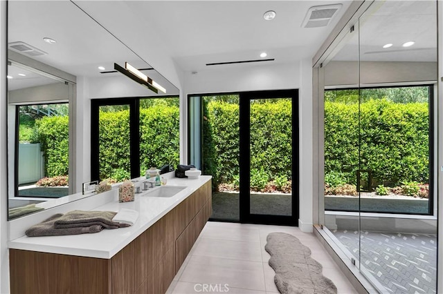 25057 Lewis And Clark Rd, Hidden Hills, CA 91302 - bathroom with double vanity, tile patterned floors, and recessed lighting