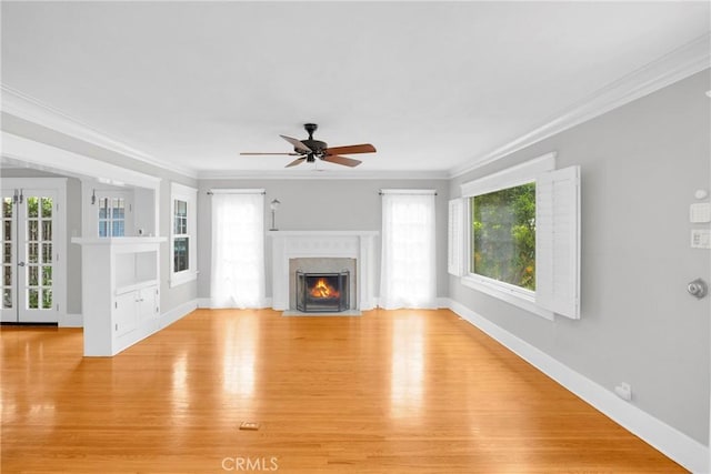 310 Hermosa, Long Beach, CA 90802 - unfurnished living room featuring a fireplace with flush hearth, light wood-style floors, ceiling fan, healthy amount of natural light, and crown molding