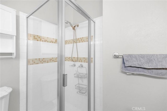 310 Hermosa, Long Beach, CA 90802 - full bathroom featuring a stall shower and a textured wall
