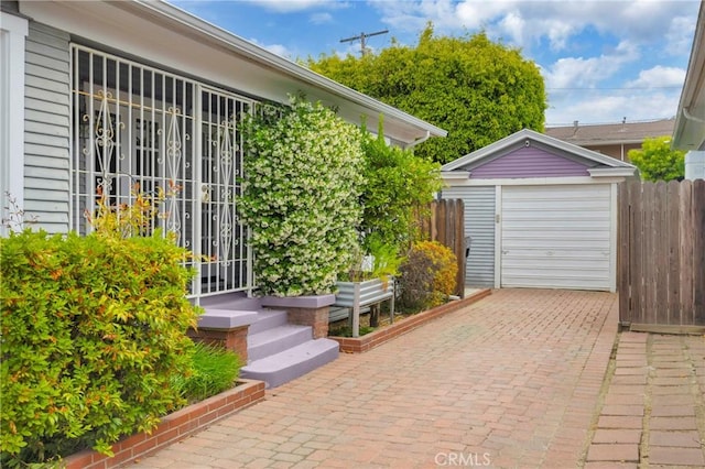 310 Hermosa, Long Beach, CA 90802 - view of patio / terrace with an outbuilding, decorative driveway, and a garage