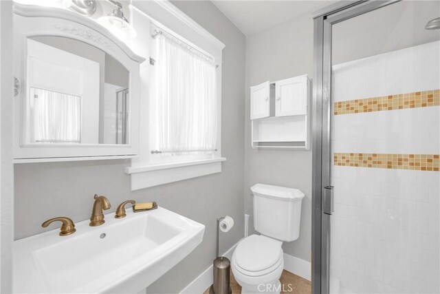 310 Hermosa, Long Beach, CA 90802 - bathroom with a sink, a shower stall, and toilet