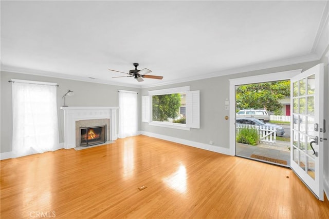 310 Hermosa, Long Beach, CA 90802 - unfurnished living room featuring plenty of natural light, crown molding, light wood-style floors, a ceiling fan, and a fireplace
