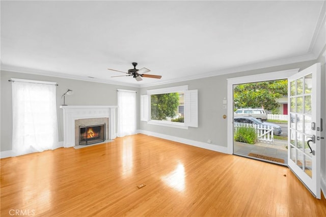 310 Hermosa, Long Beach, CA 90802 - unfurnished living room featuring healthy amount of natural light, ornamental molding, a ceiling fan, wood finished floors, and a premium fireplace