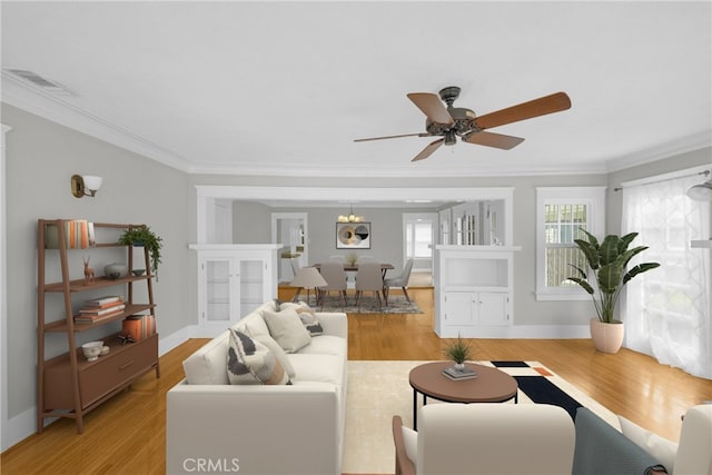 310 Hermosa, Long Beach, CA 90802 - living room featuring crown molding, light wood-style floors, a ceiling fan, and baseboards