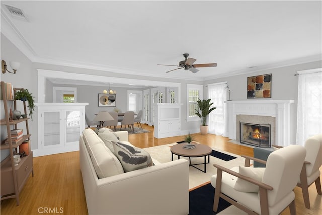 310 Hermosa, Long Beach, CA 90802 - living area with healthy amount of natural light, a fireplace with flush hearth, a ceiling fan, and crown molding