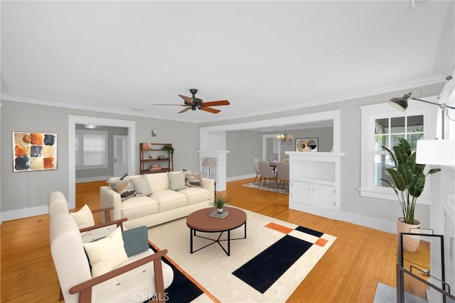 310 Hermosa, Long Beach, CA 90802 - living room featuring ornamental molding, wood finished floors, a ceiling fan, baseboards, and a chandelier