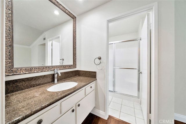 6211 Newhaven Ct Unit 128, Yorba Linda, CA 92887 - bathroom featuring a stall shower, vanity, and baseboards