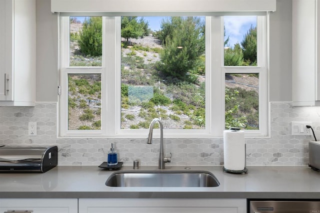 2896 Via Alta Pl, San Diego, CA 92108 - kitchen with a sink, dishwasher, white cabinetry, and tasteful backsplash
