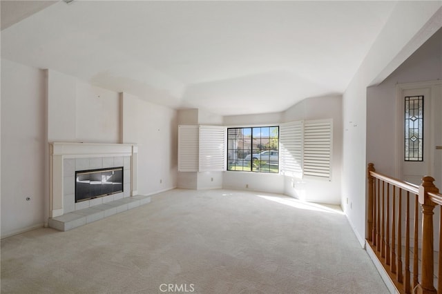 2207 Inverness Ct, Oxnard, CA 93036 - unfurnished living room with carpet, a tile fireplace, and baseboards
