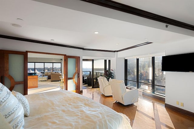 200 Harbor Dr Unit 1502, San Diego, CA 92101 - bedroom with crown molding, wood finished floors, access to outside, baseboards, and recessed lighting