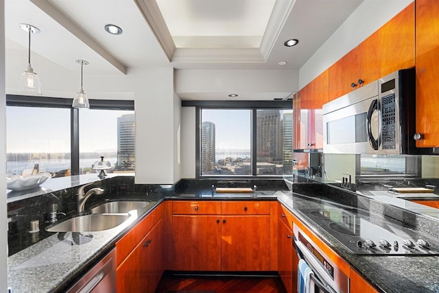 200 Harbor Dr Unit 1502, San Diego, CA 92101 - kitchen with stainless steel appliances, a sink, brown cabinetry, and dark stone countertops
