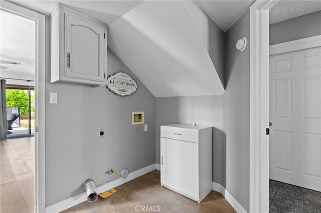 7209 Copper Creek Way, Bakersfield, CA 93308 - laundry area with washer hookup, hookup for an electric dryer, gas dryer hookup, wood finished floors, and cabinet space