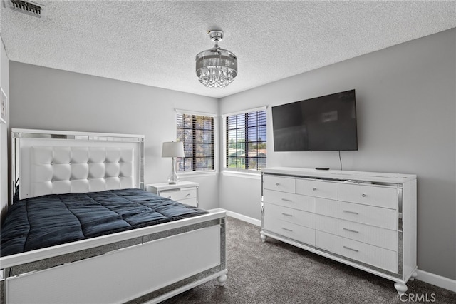 7209 Copper Creek Way, Bakersfield, CA 93308 - bedroom with dark carpet, baseboards, a chandelier, and a textured ceiling