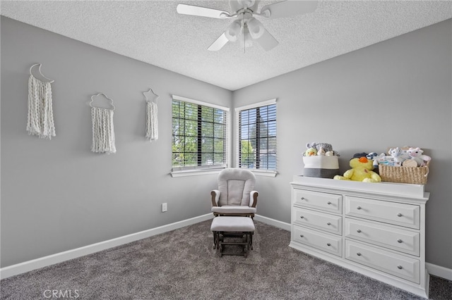 7209 Copper Creek Way, Bakersfield, CA 93308 - sitting room featuring a textured ceiling, ceiling fan, dark colored carpet, and baseboards