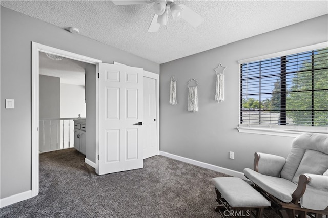 7209 Copper Creek Way, Bakersfield, CA 93308 - sitting room with ceiling fan, dark carpet, a textured ceiling, and baseboards