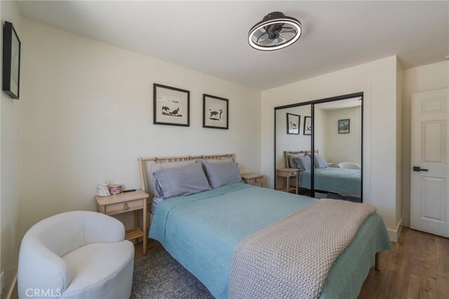 17392 Almelo Ln, Huntington Beach, CA 92649 - bedroom with wood finished floors, a closet, and baseboards