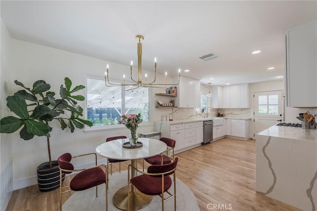 17392 Almelo Ln, Huntington Beach, CA 92649 - dining room featuring light wood-style floors, a chandelier, baseboards, and recessed lighting