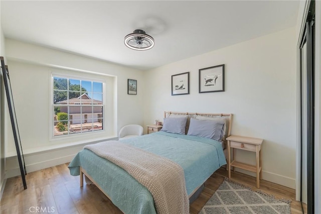 17392 Almelo Ln, Huntington Beach, CA 92649 - bedroom with baseboards and wood finished floors
