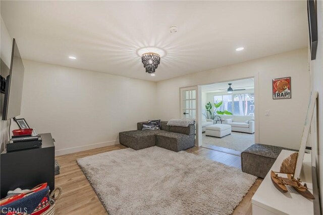 17392 Almelo Ln, Huntington Beach, CA 92649 - living area featuring light wood-style flooring, a ceiling fan, recessed lighting, and baseboards