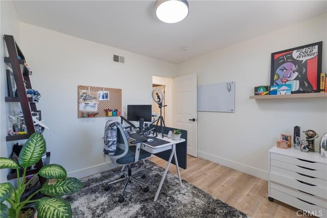 17392 Almelo Ln, Huntington Beach, CA 92649 - home office featuring baseboards and light wood-style flooring