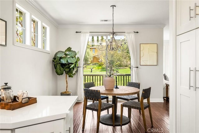10108 Marchant Ave, Tustin, CA 92782 - dining room featuring dark wood-style flooring, a chandelier, baseboards, and ornamental molding