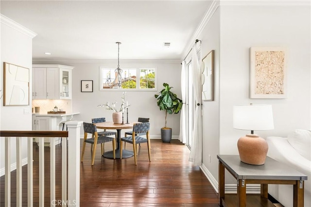 10108 Marchant Ave, Tustin, CA 92782 - dining room with dark wood finished floors, crown molding, and baseboards