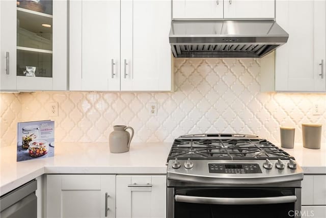 10108 Marchant Ave, Tustin, CA 92782 - kitchen with stainless steel gas range, wall chimney range hood, white cabinets, and light countertops
