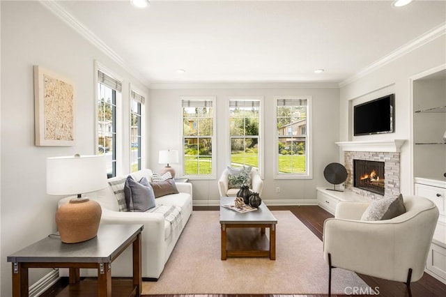 10108 Marchant Ave, Tustin, CA 92782 - living room featuring plenty of natural light, crown molding, a stone fireplace, recessed lighting, and wood finished floors